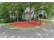 Two story home at a corner lot with well manicured flower beds at 4300 May Apple Dr, Alpharetta, GA 30005