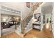 Inviting foyer with hardwood floors, staircase with iron spindles, and opens to the living room at 4300 May Apple Dr, Alpharetta, GA 30005