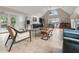 Modern living room area with tiled floors, vaulted ceilings, natural light, and contemporary furniture at 4300 May Apple Dr, Alpharetta, GA 30005