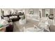 Open-concept living area with modern finishes and comfortable seating with bright, natural light at 4300 May Apple Dr, Alpharetta, GA 30005