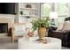 Bright living room featuring stylish decor, fireplace, and comfortable seating at 4300 May Apple Dr, Alpharetta, GA 30005