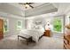 Main bedroom featuring tray ceilings and abundant natural light at 4300 May Apple Dr, Alpharetta, GA 30005