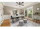 Comfortable office space featuring large windows for natural light, custom built-ins, and neutral decor at 4300 May Apple Dr, Alpharetta, GA 30005