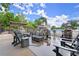 Outdoor space with Adirondack chairs, a fire pit, and a pool view surrounded by a black fence at 4300 May Apple Dr, Alpharetta, GA 30005