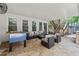 Covered patio with comfortable seating, a foosball table, and access to the backyard at 4300 May Apple Dr, Alpharetta, GA 30005