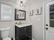 Cozy half-bathroom with stylish vanity and updated fixtures at 5242 Mccarter Sta, Stone Mountain, GA 30088