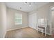 Bright bedroom featuring a vanity, ample closet space, and natural light from the window at 5242 Mccarter Sta, Stone Mountain, GA 30088