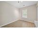 Simple, cozy bedroom with light flooring and ample natural light at 5242 Mccarter Sta, Stone Mountain, GA 30088