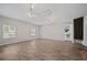 Large bonus room with wood-look floors, recessed lights, and two windows at 5242 Mccarter Sta, Stone Mountain, GA 30088