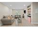 Comfortable living room with modern furniture and ample storage shelving at 5242 Mccarter Sta, Stone Mountain, GA 30088