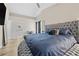 Bright main bedroom showcases a luxurious round bed and en-suite bathroom access at 5242 Mccarter Sta, Stone Mountain, GA 30088