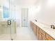 Bright bathroom featuring double vanity, with modern fixtures, and glass shower at 6525 Rhett Run, Cumming, GA 30028