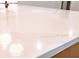 Close up of white countertop featuring gold veining accents at 6525 Rhett Run, Cumming, GA 30028