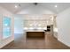 Bright open concept kitchen featuring a large island and stainless steel appliances at 6525 Rhett Run, Cumming, GA 30028
