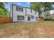 Large backyard with patio space and partial fencing offers plenty of room to play and entertain at 1841 Surrey Hill Cir, Lawrenceville, GA 30044
