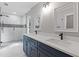 Modern bathroom with double vanity, glass shower, and sleek black hardware at 1841 Surrey Hill Cir, Lawrenceville, GA 30044