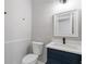 Updated bathroom with navy blue vanity, modern fixtures, and bright lighting at 1841 Surrey Hill Cir, Lawrenceville, GA 30044