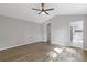 Spacious bedroom with vaulted ceiling, large windows, and view to the bathroom at 1841 Surrey Hill Cir, Lawrenceville, GA 30044