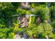 An aerial perspective highlights the luxurious home, expansive grounds, secluded pool, and surrounding lush greenery at 1865 Mason Mill Rd, Decatur, GA 30033