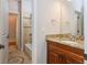 Bathroom vanity with granite countertop and dark wood cabinets at 1865 Mason Mill Rd, Decatur, GA 30033