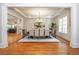 Formal dining room with chandelier, hardwood floors, and decorative molding at 1865 Mason Mill Rd, Decatur, GA 30033