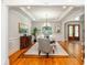 Spacious dining room featuring elegant trim work, chandelier, and hardwood floors at 1865 Mason Mill Rd, Decatur, GA 30033