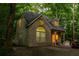 Unique house with stone facade and interesting architecture sitting among mature trees at 1865 Mason Mill Rd, Decatur, GA 30033