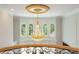 Elegant foyer with high ceilings, chandelier, and arched windows overlooking greenery at 1865 Mason Mill Rd, Decatur, GA 30033