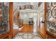 Grand foyer with mosaic tile floor, staircase, and wrought iron railing, creating a welcoming entrance at 1865 Mason Mill Rd, Decatur, GA 30033