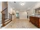 Foyer with tiled floor and a wooden staircase at 1865 Mason Mill Rd, Decatur, GA 30033