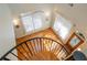 Foyer with beautiful hardwood floors, a curved staircase, and a stained glass door at 1865 Mason Mill Rd, Decatur, GA 30033