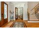 Grand foyer features hardwood floors, mosaic tile, and an elegant staircase leading to the upper level at 1865 Mason Mill Rd, Decatur, GA 30033