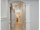 Bright hallway with decorative columns and archways, leading to other areas of the home at 1865 Mason Mill Rd, Decatur, GA 30033