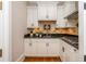 Compact kitchen with gas cooktop, stainless steel appliances, and white cabinets, ideal for small spaces at 1865 Mason Mill Rd, Decatur, GA 30033