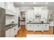 Well-equipped kitchen with modern appliances, custom cabinetry, and black granite countertops, perfect for cooking at 1865 Mason Mill Rd, Decatur, GA 30033