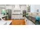 Gourmet kitchen featuring stainless steel appliances and custom white cabinetry and dark granite countertops at 1865 Mason Mill Rd, Decatur, GA 30033