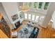 Spacious living room with fireplace, built-ins, hardwood floors, and chandelier at 1865 Mason Mill Rd, Decatur, GA 30033