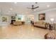Expansive living area with tile flooring, recessed lighting, and multiple seating areas at 1865 Mason Mill Rd, Decatur, GA 30033