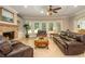 Bright living room with fireplace, tile flooring, and large windows with views to the outdoors at 1865 Mason Mill Rd, Decatur, GA 30033