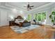 Luxury main bedroom with trey ceiling, hardwood floors, and ample natural light at 1865 Mason Mill Rd, Decatur, GA 30033