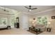 Open main bedroom featuring a sitting area, ceiling fans, and natural light at 1865 Mason Mill Rd, Decatur, GA 30033