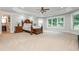 Spacious main bedroom with tray ceiling, large windows, and ensuite bathroom access at 1865 Mason Mill Rd, Decatur, GA 30033