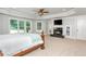 Serene main bedroom featuring a fireplace, large windows, and ample natural light at 1865 Mason Mill Rd, Decatur, GA 30033