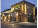 Exterior view of Taziki's Mediterranean Cafe featuring a well-lit building and outdoor seating at 1865 Mason Mill Rd, Decatur, GA 30033