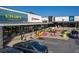 Exterior view of a vibrant shopping center with colorful storefronts, outdoor seating, and ample parking at 1865 Mason Mill Rd, Decatur, GA 30033