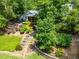 Lush backyard landscaping featuring terraced gardens, stone pathways, and an outdoor fire pit area at 3912 Edenton Ne Ct, Brookhaven, GA 30319