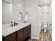 Stylish bathroom with a vanity, quartz countertop, modern fixtures, and a tiled floor at 4275 Green Summers Dr, Cumming, GA 30028