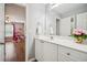 Bathroom with white vanity, granite countertop, and adjacent bedroom at 4275 Green Summers Dr, Cumming, GA 30028