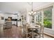 Breakfast area with a chandelier, large windows and is open to the kitchen, with a view of the screened-in patio at 4275 Green Summers Dr, Cumming, GA 30028