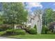 Beautifully landscaped home with green lawn and mature trees, offering a serene and inviting exterior at 4275 Green Summers Dr, Cumming, GA 30028